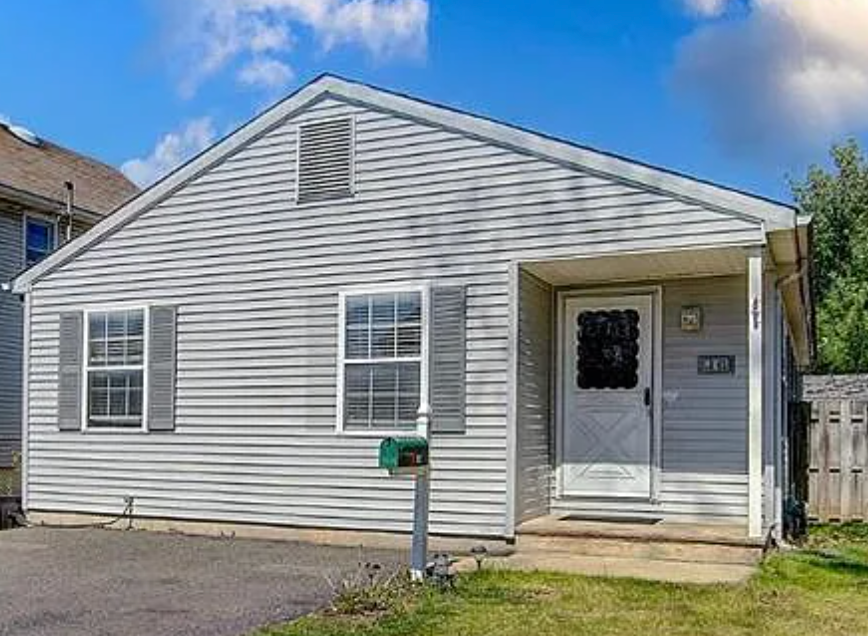 Exterior of one of our sold properties with white siding.