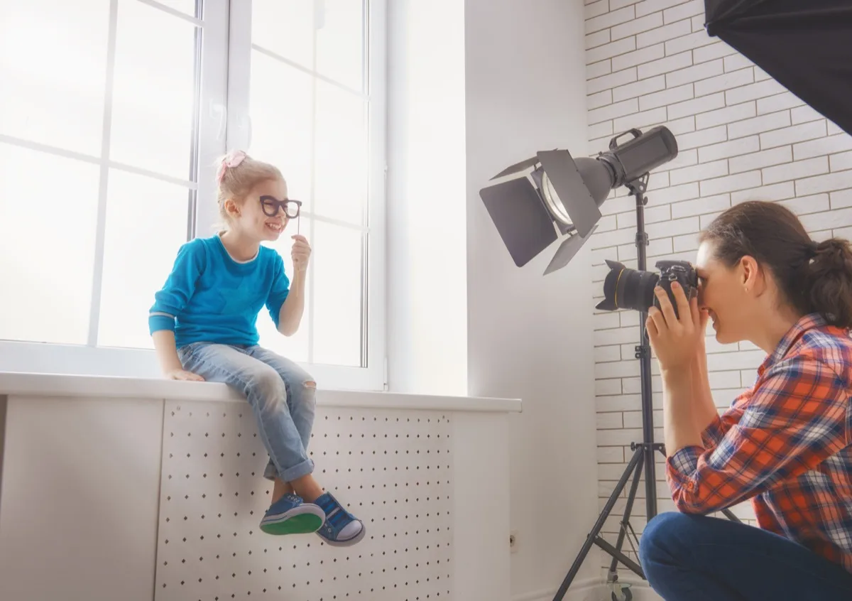 mother-photographing-daughter.webp