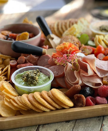 Close up of grazing platter of cheeses and meat and fruits