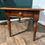 Thumbnail: Victorian Mahogany Table with Rexine Top and Brass Border