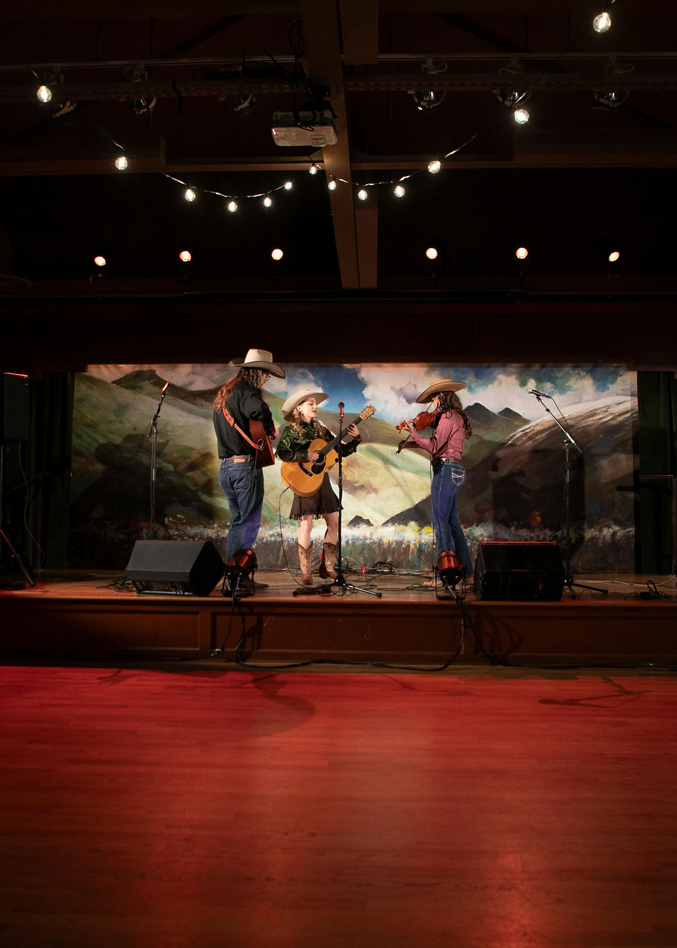 Kristyn Harris Trio performing on stage at Western Folklife Center in Elko, NV.