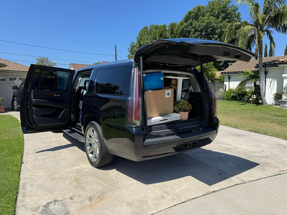 Film prop and transportation Cadillac Escalade filled to the brim.