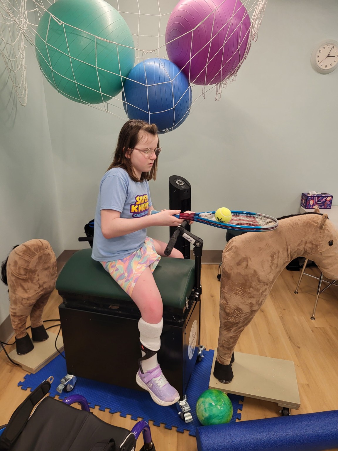 Mane Motions participant practicing coordination activities while riding the MiraColt