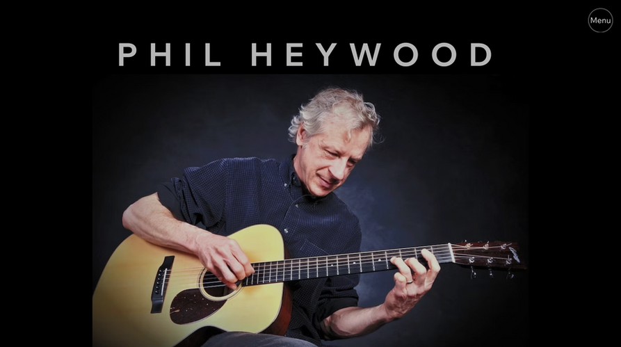 Musician playing acoustic guitar