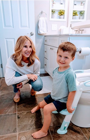 Nanny providing expert potty training guidance to a toddler.