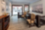 Hotel lobby with inviting lounge seating and patio view
