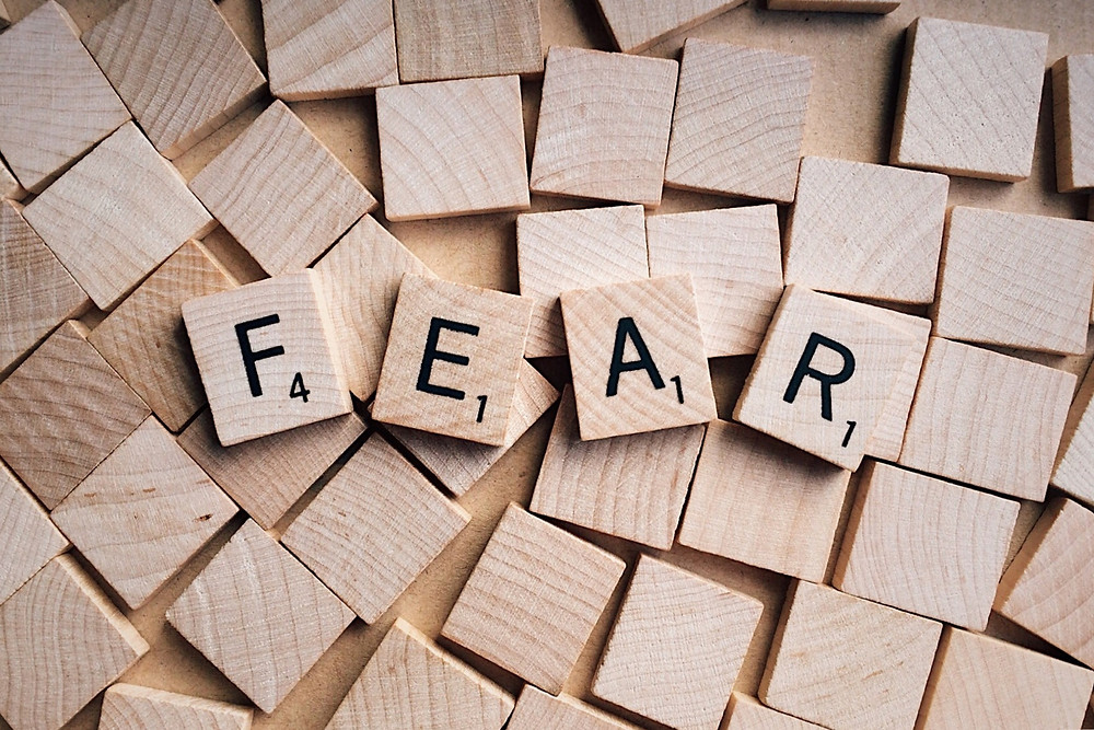 The word fear spelled out in Scrabble letters