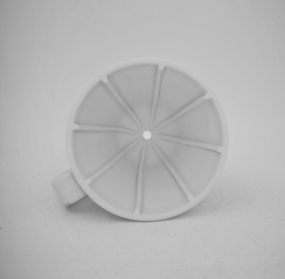 Thumbnail: A black and white photo of an unglazed stoneware coffee pour over from above.