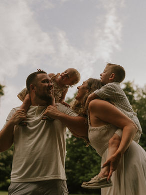 parents with children on their backs, smiling and laughing