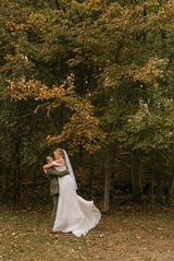 Groom lifting bride for an embrace at Annapolis Maritime Park