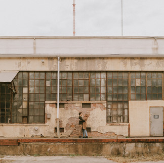 engaged couple posing for photo in Clippers Mill, Baltimore