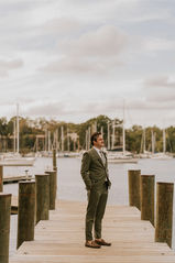 Annapolis groom waits for his bride on a dock before their first look