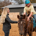 Lesson student getting instruction from trainer during lesson