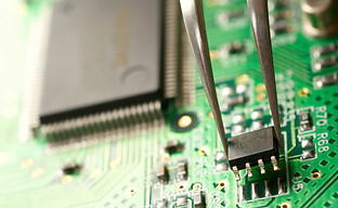 depositphotos_12177917-stock-photo-assembling-a-circuit-board.jpg