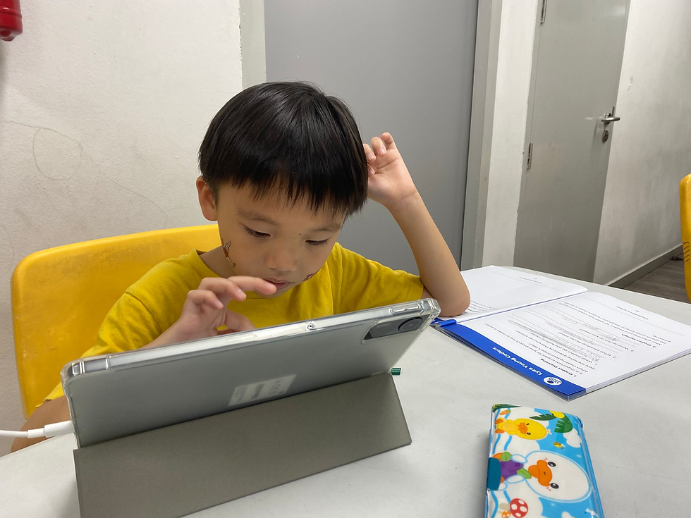 A student doing block-based coding in a class