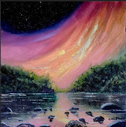 A sweeping ribbon of colorful northern lights arches across the night sky above a rocky river lined with evergreen trees.