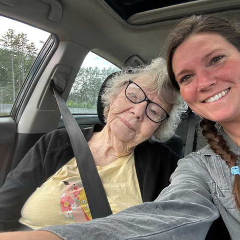 mber and her grandmother smiling together after shopping for bedding plants that inspired Honeydew Farm's love of cut flowers.