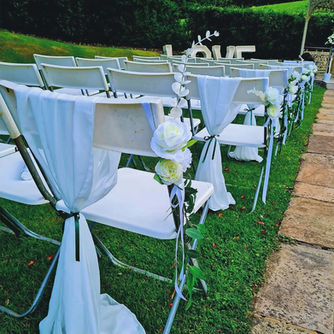 Cream chiffon drapes and flowers at Lodore Falls