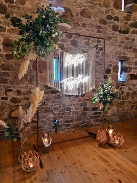 Cooper Frame, Neon Light, Greenery, and Macrame at Three Hills Barn, Torpenhow, Cumbria