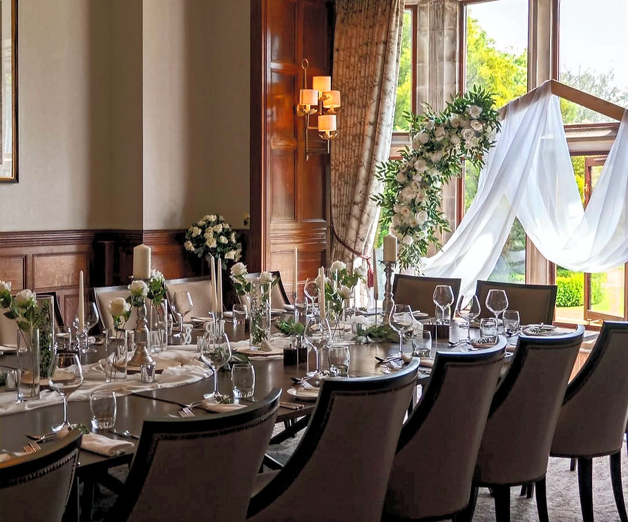 Elegant dining table set for a special event with floral decorations and Home.