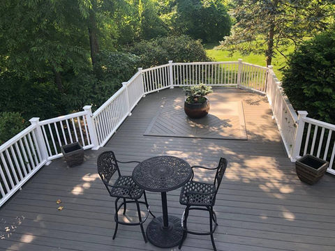 Deck addition with white vinyl deck rails