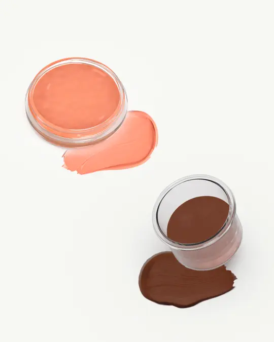 co.8 liquid makeup in containers filled with coral blush and dark brown foundation.webp