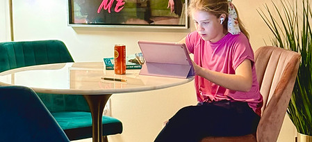 Female student in study lounge sitting at table