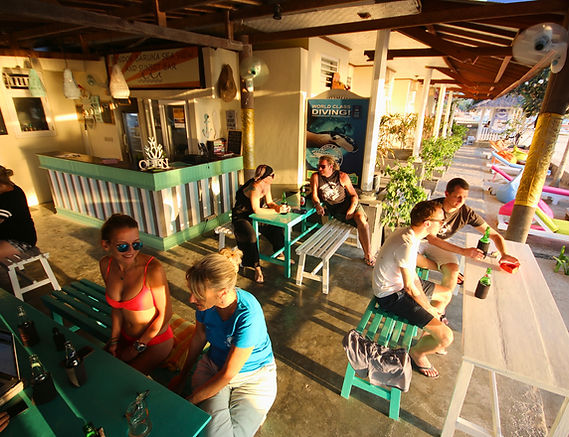 Relaxing and meeting new friends at sunset bar with world diving