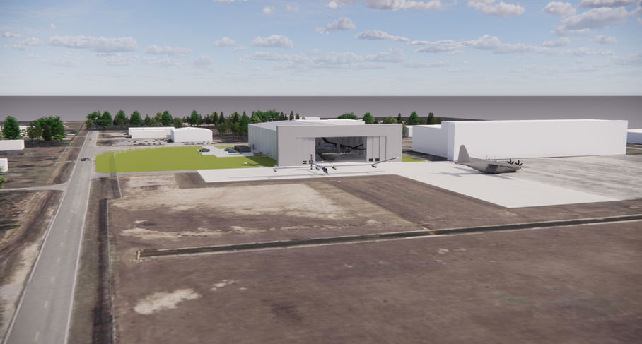 Aerial view modern hangar development with large glass facade.