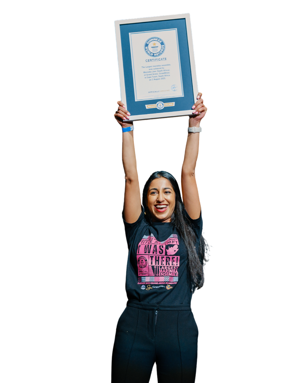 Marimba Jam founder, Kiara Ramklass holding up Guinness World Records certificate