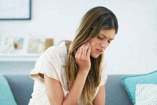 Patient with tooth pain waiting to be seen by dentist for an emergency dental visit
