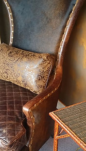 Old Hickory Tannery leather hide chair and tooled leather pillow