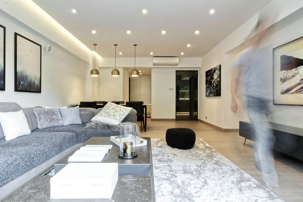 Contemporary Living / Dining room with marble extendable dining and brass pendant lights also a majestic adjustable sofa