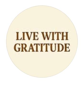 Round badge-style logo with the words 'LIVE WITH GRATITUDE' in brown on a light cream circle.