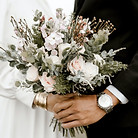 bridge-and-groom-standing-while-holding-