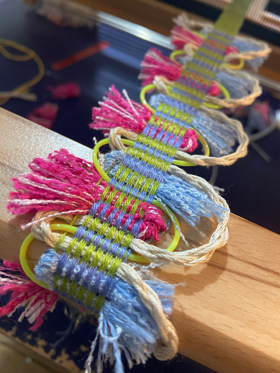 First passementerie warp using bamboo yarn. This piece incorporates scoubidous, handmade tassels and hand twisted cord