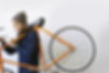 Man Holding Bicycle