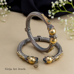 Ornate jadau silver and gold bangles
