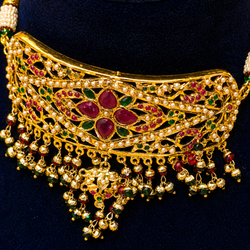 Jadau Chokar necklace with rubies, emeralds, and pearls