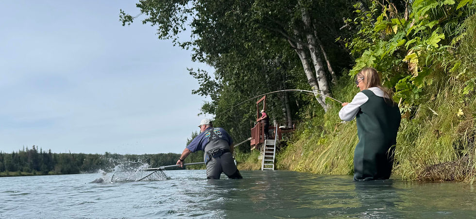 Women-and-man-fishing-salmon-Kenai-River-Suites-