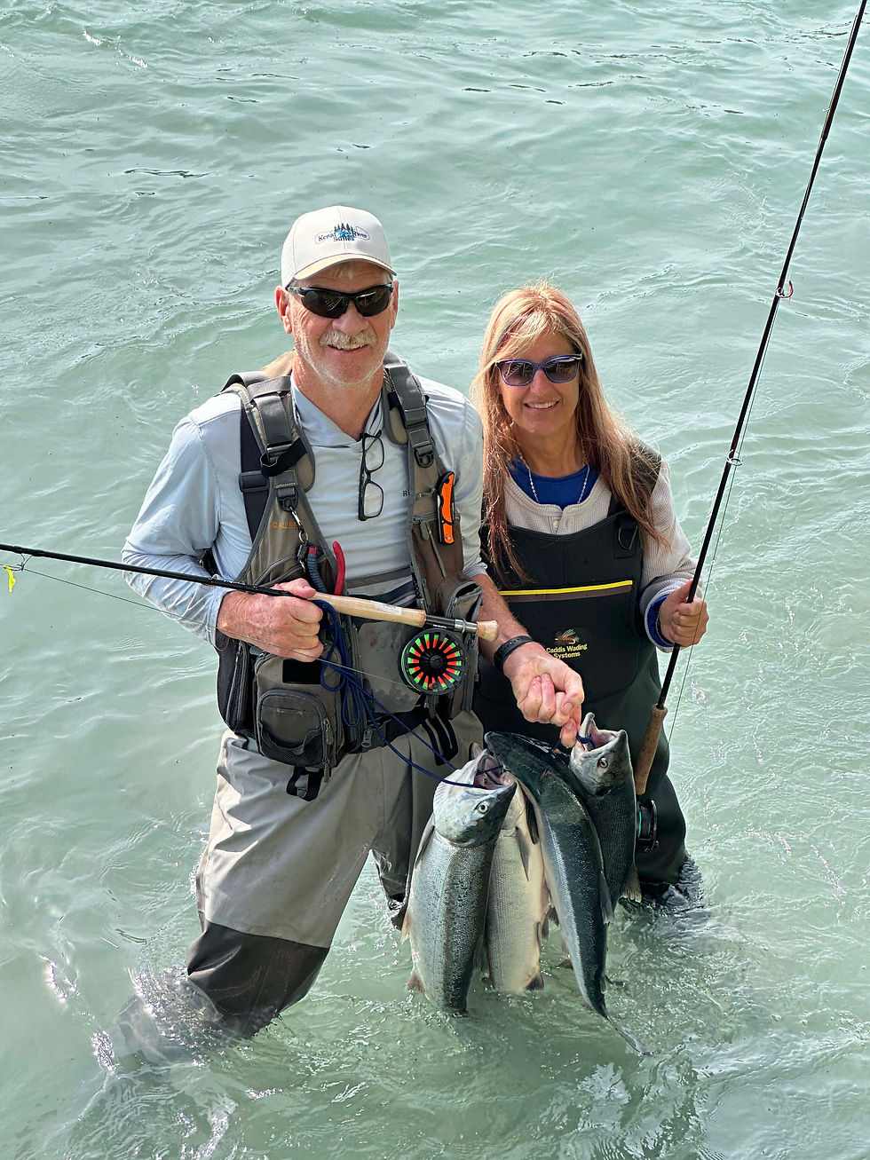 Woman-and-man--fishing-salmon-Kenai-River-Suites-