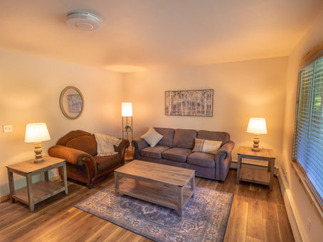 One of the charming living rooms at Kenai River Suites