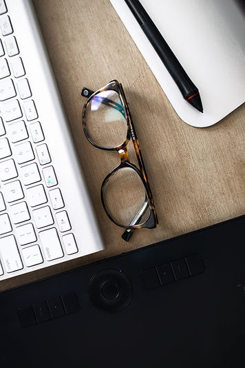 close-up-of-eye-glasses-on-a-computer-desk (1).jpg