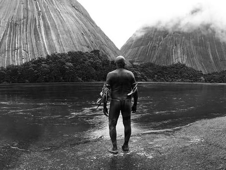 Shaman standing somewhere in the Amazon forest