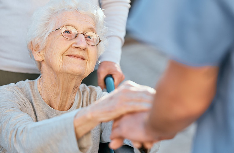 holding-hands-caregiver-senior-woman-wheelchair-support-outdoor-retirement-home-love-trust
