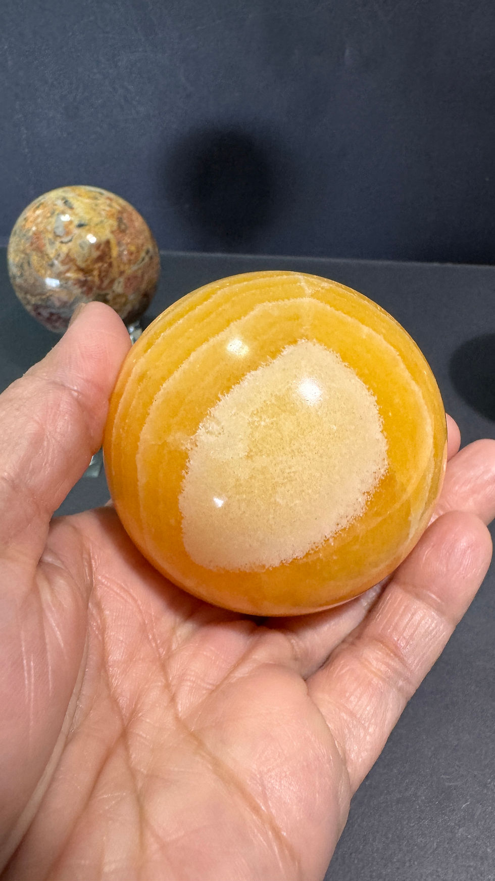 Thumbnail: Yellow banded calcite sphere with holder 64MM diameter 370grams 