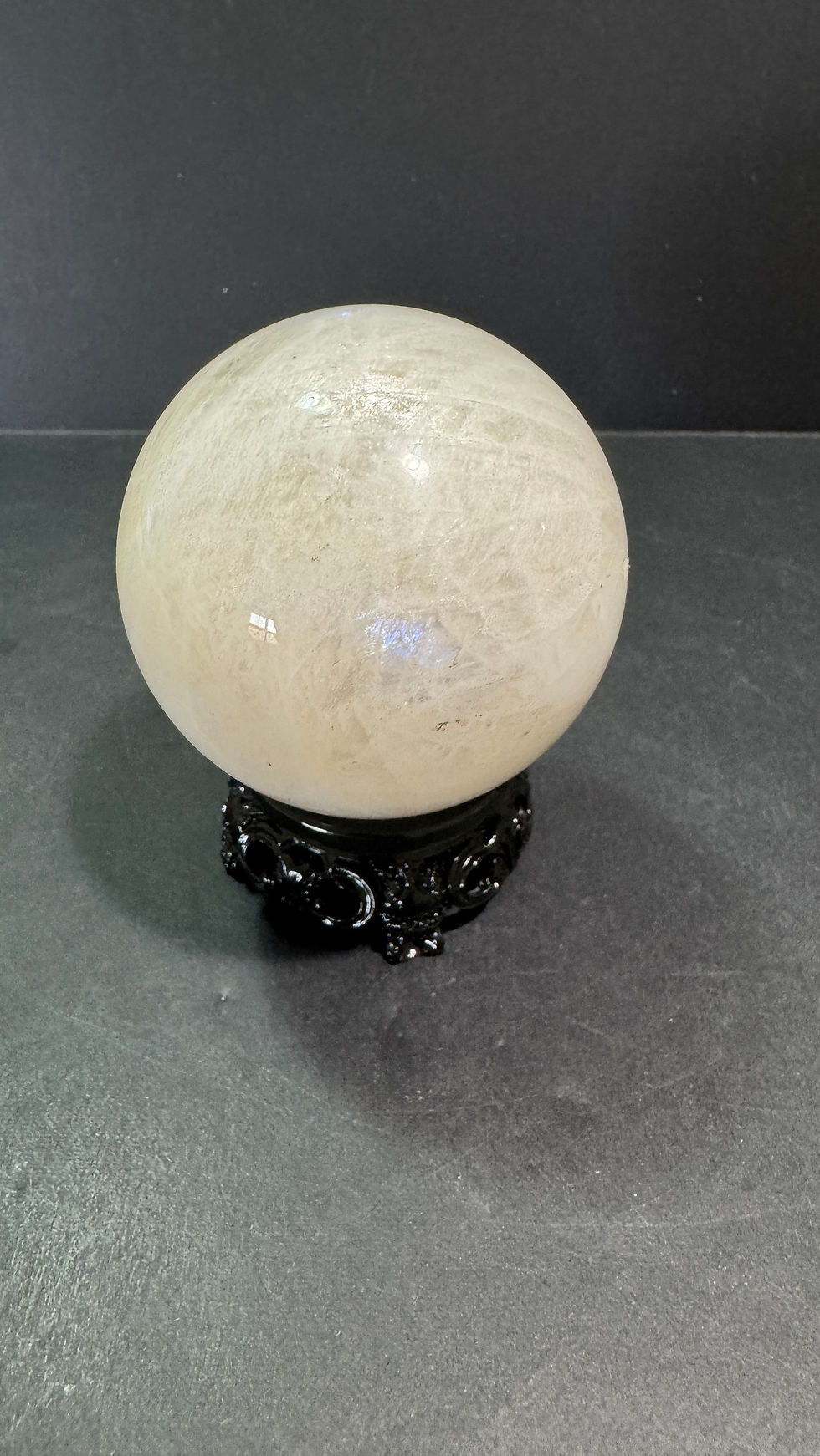 Rainbow moonstone with sphere holder 394grams 63MM diameter