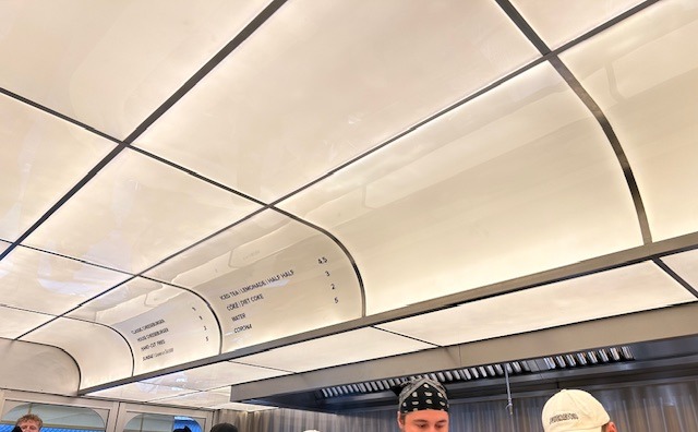 A menu on the ceiling of a restaurant