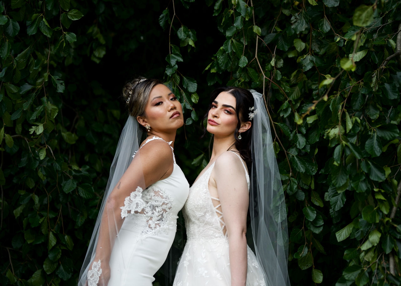  Two models in styled bridal shoot with makeup and hair artistry at Springbank Park London Ontario.