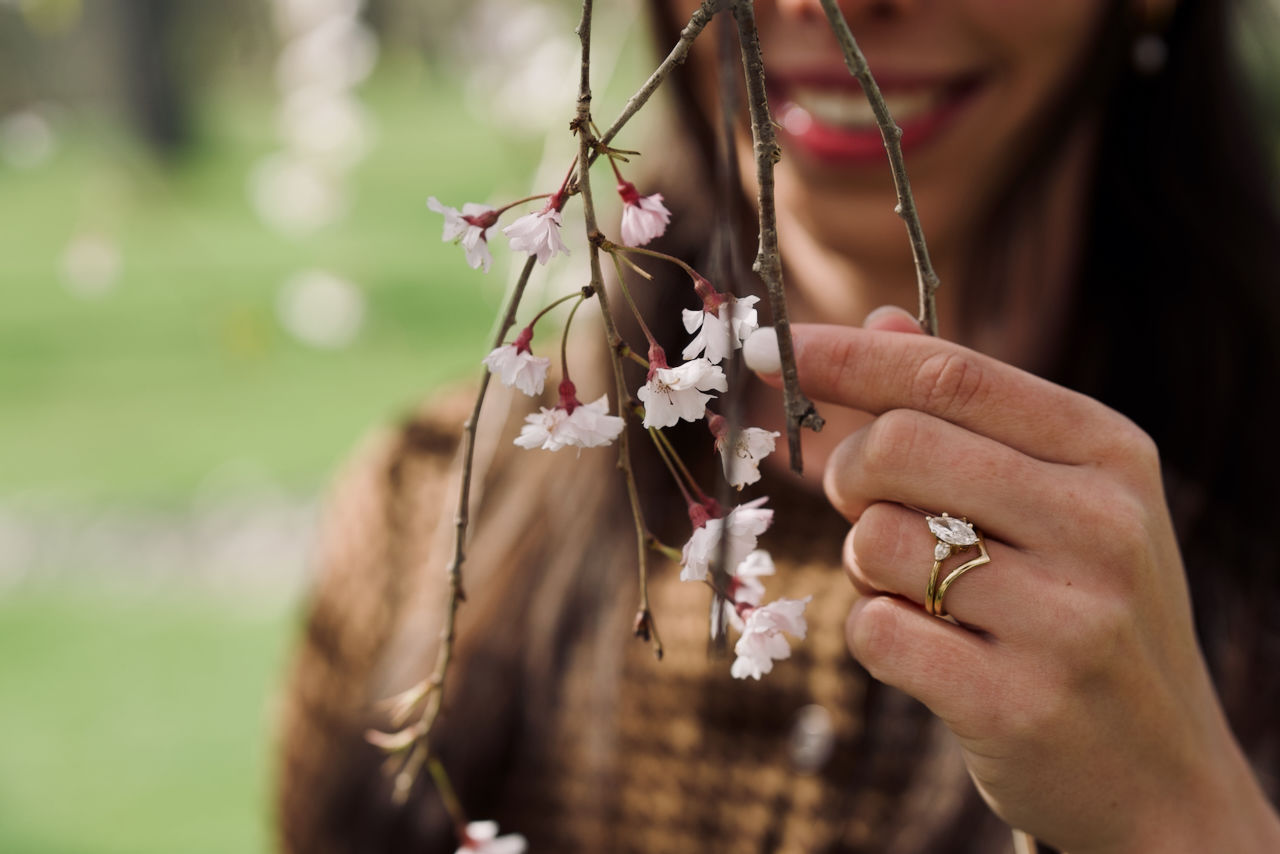 Outdoor spring fashion portrait in London Ontario with blooming trees and golden hour lighting